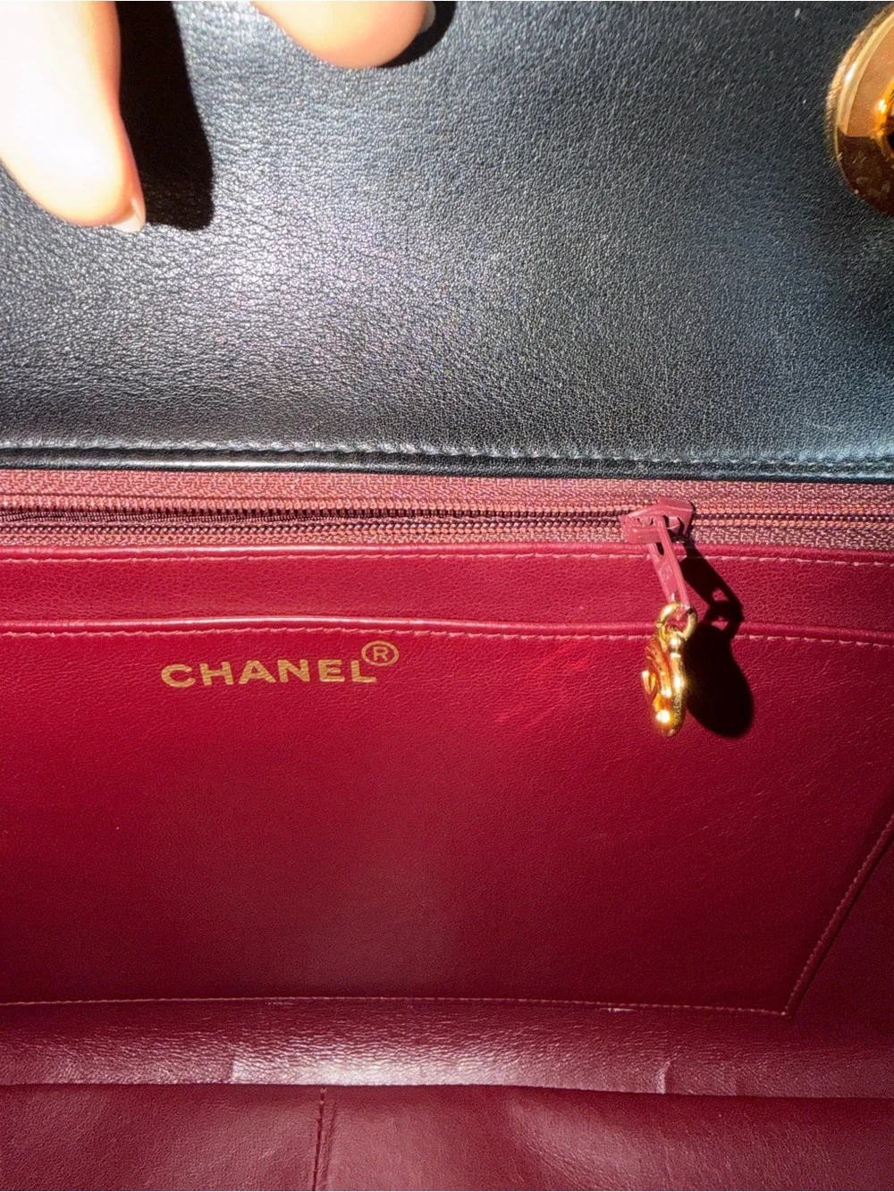 CHANEL Black Quilted Shoulder Bag with Gold Chain & CC Lock